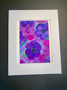 Framed artwork of purple flowers on a gray background